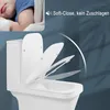A baby sleeping next to a toilet with the lid open, highlighting the soft-close feature. Podgląd zdjęcia produktu