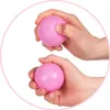 Hands holding pink balls. Produktbild-Vorschau