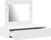 A white vanity table with a mirror and lights, and an open drawer. Náhled obrázku produktu