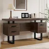 A modern desk with drawers and a laptop on it, set against a white wall with artwork. Podgląd zdjęcia produktu