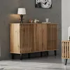 A wooden sideboard with slatted doors and black legs, placed against a gray wall. Anteprima dell’immagine prodotto