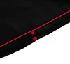 A close-up view of black fabric with red piping and two red buttons. Náhľad obrázku produktu