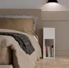 A bedroom scene with a bed and a nightstand. Anteprima dell’immagine prodotto