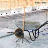 Construction site with a wheelbarrow and tools. Produktbild-Vorschau