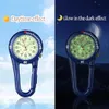 A split image showing a blue carabiner watch in daylight and glowing in the dark. Produktbild-Vorschau