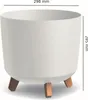 A white planter pot with three wooden legs, shown from a slightly elevated side angle. Dimensions are indicated by text and lines. Náhľad obrázku produktu