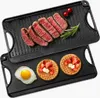 A double-sided cast iron griddle pan with food items on it. Anteprima dell’immagine prodotto