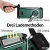 The image shows three different ways to charge a green emergency radio: by hand crank, solar panel, and USB. Produktbild-Vorschau