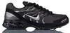 A side profile of a black Nike Air Max Torch 4 sneaker against a white background. Voir les images du produit