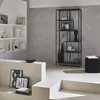 A modern living room with a black metal bookshelf and minimalist decor. Produktbild-Vorschau