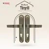 A pair of bronze-colored door handles with a keyhole plate, presented against a light beige and white patterned background with graphic elements. Produktbild-Vorschau