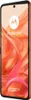 A close-up, angled view of an orange Motorola Razr 50 smartphone with a vibrant, abstract background. Produktbild-Vorschau