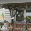 An outdoor dining setup under a gazebo with a table set for a meal. Produktbild-Vorschau