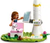 A LEGO Friends set featuring a mini-doll, a dog, a solar-powered rocket, and a charging station. Náhled obrázku produktu