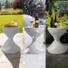 A collage showing a side table in different weather conditions: sunny, snowy, and rainy. Anteprima dell’immagine prodotto