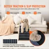 A small dog is on a pet ramp placed in front of a sofa. Anteprima dell’immagine prodotto