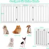 A product image showing a white wooden dog gate with various small dog breeds pictured below it, along with size dimensions. Produktbild-Vorschau