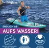 A man is kneeling on a paddleboard in the water, holding a paddle. Produktbild-Vorschau