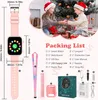Two children are opening Christmas presents, with a smartwatch and its accessories laid out in the foreground. Voir les images du produit