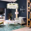 A luxurious living room with a large chandelier, a sofa, a coffee table, and a decorative screen. Produktbild-Vorschau
