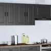 A modern kitchen scene with dark gray cabinets, a stovetop, and various kitchen items on the counter. Podgląd zdjęcia produktu