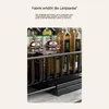 A close-up view of a kitchen organizer shelf with various bottles and jars. Voir les images du produit