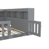 A close-up view of a gray wooden children's bed with a built-in bookshelf and a safety rail. Produktbild-Vorschau