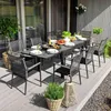 An outdoor dining set on a wooden deck, with food and drinks on the table. Náhled obrázku produktu