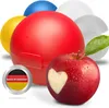 Several colorful round containers and a red apple with a heart carved into it. Produktbild-Vorschau