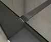 A close-up view of a shower enclosure corner, showing the glass panel, a metal support bar, and the shower tray. Produktbild-Vorschau