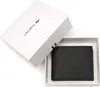 A black Lacoste wallet is presented in its white gift box. Produktbild-Vorschau