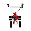 A red and white powered sweeper with black wheels and brush, shown from the front on a white background. Produktbild-Vorschau