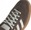 Close-up view of the toe area of a brown Adidas sneaker. Voir les images du produit