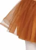 Close-up of the hem of a brown tulle skirt. Produktbild-Vorschau