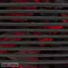 A close-up view of a grill grate over glowing red coals. Produktbild-Vorschau