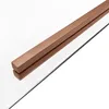 A close-up shot of a shower cabin's copper-colored handle and glass. Anteprima dell’immagine prodotto