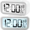 Two digital alarm clocks are shown against a white background. Voir les images du produit