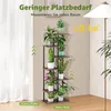 A multi-tiered plant stand filled with various potted plants, placed indoors near a window and a floor lamp. Produktbild-Vorschau