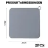A gray square silicone drain cover with dimensions indicated. Produktbild-Vorschau