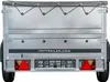 The rear view of a small, silver utility trailer with a grey tarp cover. Produktbild-Vorschau