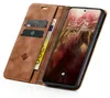 A brown leather flip case for a smartphone, open to reveal the phone screen and card slots. Produktbild-Vorschau