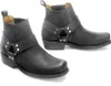 A pair of black leather biker boots with harness detailing, shown against a white background. Produktbild-Vorschau