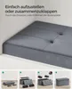 A grey storage ottoman with instructional images demonstrating assembly. Produktbild-Vorschau