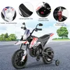 A toy motorcycle with feature callouts and a natural background. Náhľad obrázku produktu