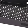 A close-up view of a black metal tray with a perforated pattern. Voir les images du produit
