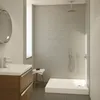 A modern bathroom with a shower tray, vanity, and sink. Produktbild-Vorschau