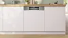 A built-in dishwasher integrated into a modern kitchen counter. Produktbild-Vorschau