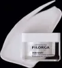 A jar of Filorga Skin-Unify cream is shown with a swirl of cream behind it against a black background. Náhľad obrázku produktu