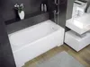 A modern bathroom with a white bathtub, a sink vanity, and wooden flooring. Produktbild-Vorschau
