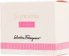 A close-up of a perfume box. Voir les images du produit